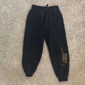 Nike Kids Black Sweatpants with Gold Swoosh
